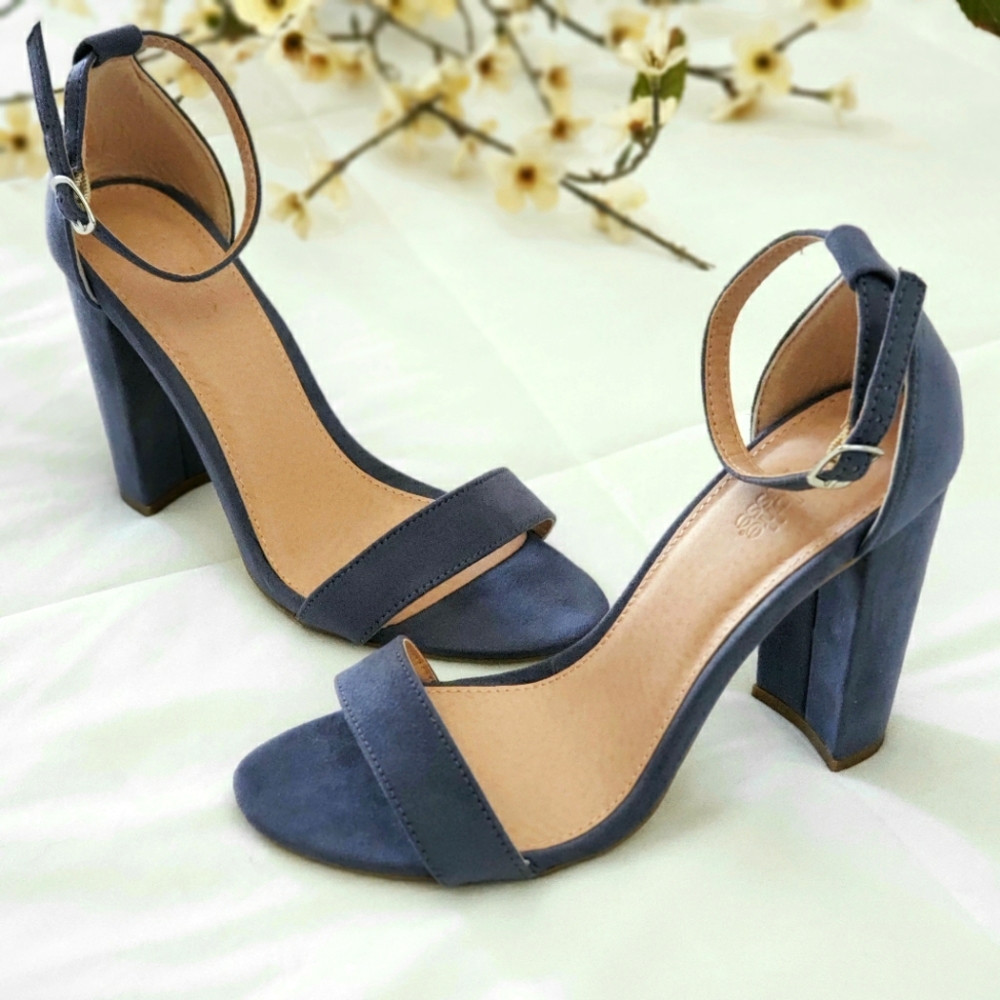 Open toe ankle strap mid block heels.